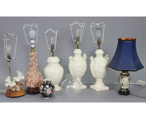 Seven table lamp bases each with shade.