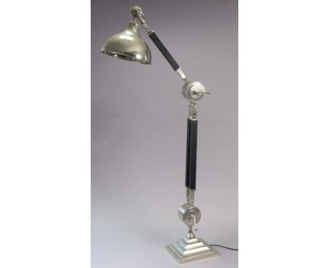 A modern chrome finish standard lamp with adjustable ebonised supports &amp; domed circular shade, on square plinth base, 195