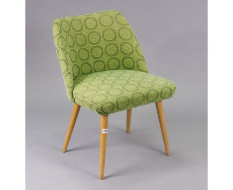 A vintage 1960s cocktail chair upholstered green geometric fabric, on round tapered blonde wood legs; &amp; a rectangular foo