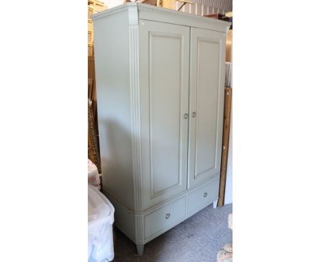 A John Lewis light grey-finish wardrobe enclosed by a pair of panel doors above two short drawers, &amp; on short square tape