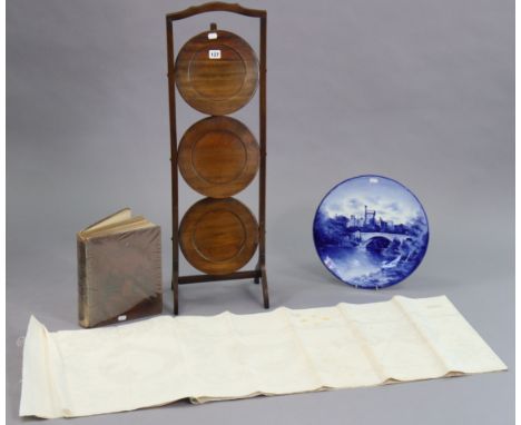 An Edwardian mahogany folding  cake stand of three circular tiers, 35¼” high; together with a Doulton Burslem blue &amp; whit