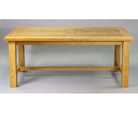 A light oak draw-leaf dining table on four square legs with plain stretchers, 90cm x179cm (closed), 9cm x 279cm (open), &amp;