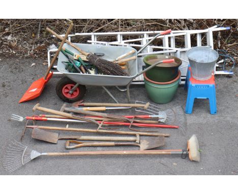 An aluminium wheelbarrow; two aluminium, ladders; various garden &amp; hand tools, etc.