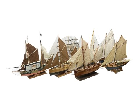 Eight model ships or boats including fishing boat with fish, nets and buoyancy aid, two mast sailing ship complete with canno