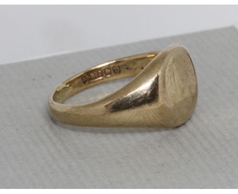 A hallmarked 9ct gold signet ring, weight 6.4g, size R.&nbsp;Condition - band re-sized and not very neat, general wear throug