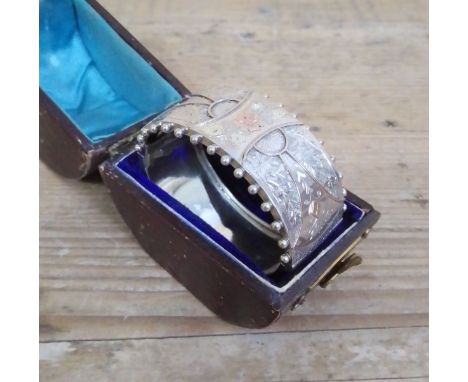 A Victorian white metal bangle, marked 'Standard', with box.&nbsp;Condition - hinge has been sightly bent backwards, clasp is