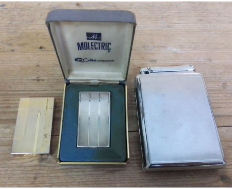 A group of three vintage lighters comprising two Colibri and one Dupont.  