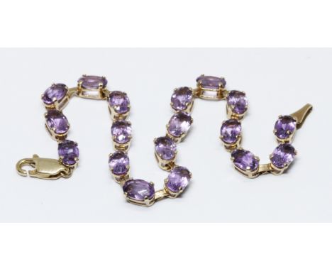 A 9ct gold amethyst bracelet, marked '10K' with 9ct gold import marks, length 17cm, gross weight 4.4g.  