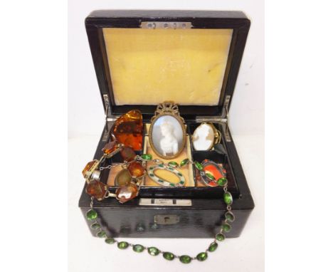 An antique leather bound jewellery box and contents including a miniature portrait, amber jewellery, silver etc.  