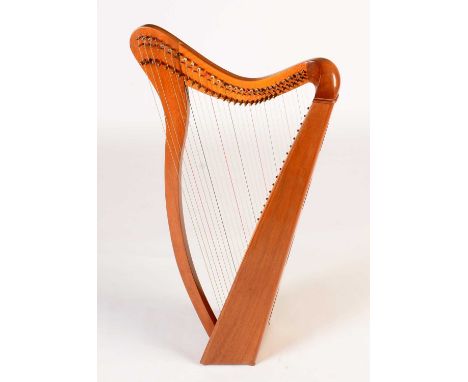 A Celtic floor standing harp, mahogany frame, spruce soundboard, in soft case, approximately 100cms high.