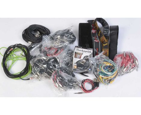 A quantity of guitar leads, short flat head jack connection leads for pedals and effects, etc.; together with four guitar str