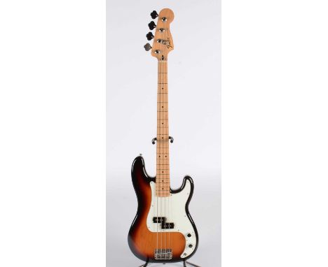 A Fender Precision Bass, made in Mexico, serial number MXX15686853, maple neck, black dot markers, three colour sunburst fini