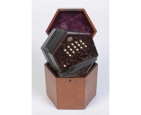 A Lachenal Anglo system concertina, serial number 157282 with 30 buttons and by-pass button, fret-cut rosewood ends, mahogany