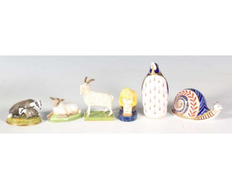 Two Royal Crown Derby Imari animal paperweights in the form of a snail and a penguin, together with three Halcyon Days animal