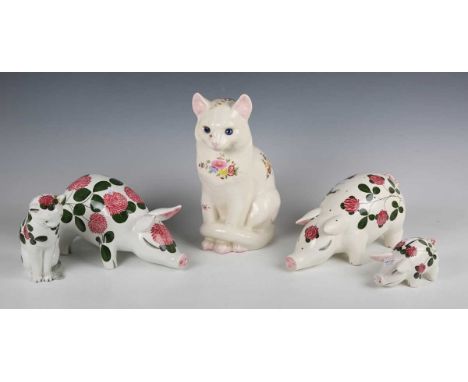 A Plichta pottery Wemyss style pig, painted with pink clover, black painted marks to base, length 22cm, a similar model of a 