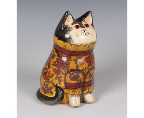 A Joan and David De Bethel Rye pottery cat, dated 1993, typically modelled seated, its brown/yellow clothing with découpage p