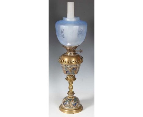 A Doulton Gothic style stoneware oil lamp, circa 1900, the pail shaped top with stylized foliate decoration and gilt metal ri