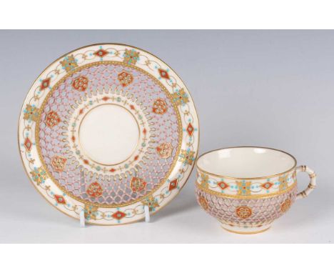 A Royal Worcester reticulated cup and saucer, circa 1875, of double-walled construction, in the style of George Owen, pierced