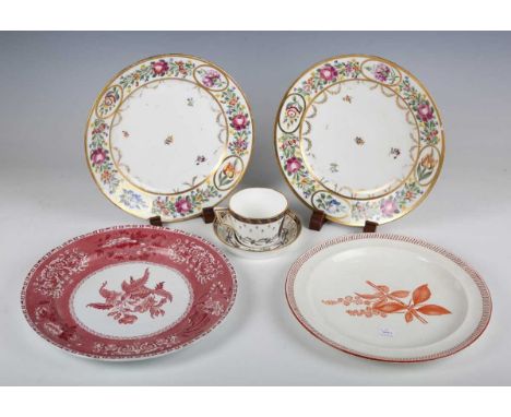 A pair of Continental porcelain plates, early 19th century, painted to the rims with flowers between gilt banding above gilt 
