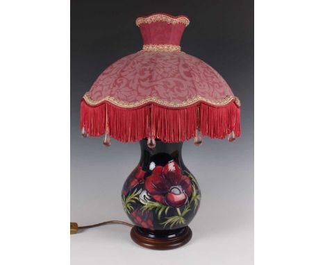 A Moorcroft Pottery Anemone pattern lampbase, circa 1988, with cobalt blue ground, raised on an integral wood base, height to