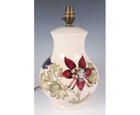 A Moorcroft Pottery Columbine pattern lampbase, 1980s, designed by Walter Moorcroft, with cream glazed ground, impressed and 
