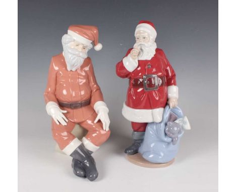 A Lladro figure Santa Is Here, No. 9485, height 33cm, together with a Nao figure of Father Christmas, height 31cm.