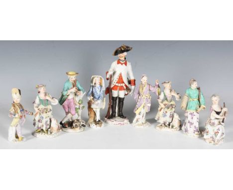 A mixed group of Continental porcelain figures, 18th and 19th century, including two Meissen shepherdesses', crossed swords i