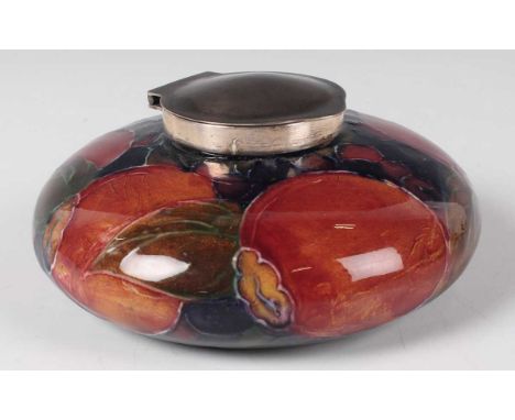 A Moorcroft Pottery silver plate mounted Pomegranate pattern inkwell, circa 1920, of flattened circular shape, indistinct imp