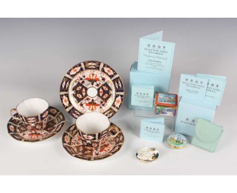 A pair of Royal Crown Derby Japan No. 2451 pattern teacups and saucers, dated 1937, and a matching side plate, dated 1928, di