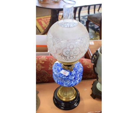 Victorian oil lamp, frosted shade over a mottled glass font, brass support and black slag pedestal, 57cm high