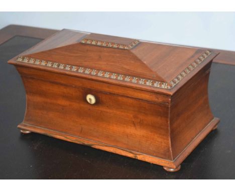 Large mahogany sarcophagus shaped tea caddy with two compartments and central bowl, 34cm wide