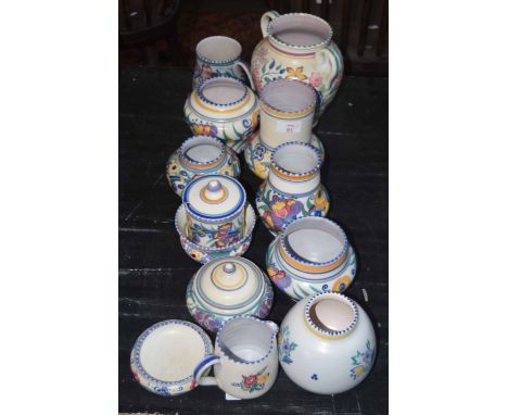 Group of Poole Pottery wares all with typical floral designs, mid-20th century, together with Poole jug, pin tray, jar and co