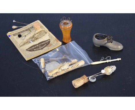 Collection of various sewing related items including hat pins, pin cushions, ivory needle cases etc    