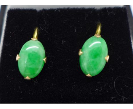 A pair of 14ct gold and jade screw back earrings