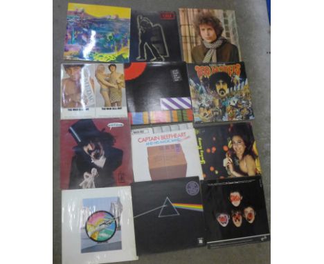 Twelve LP records including The Who, Pink Floyd, T-Rex and Juicy Lucy