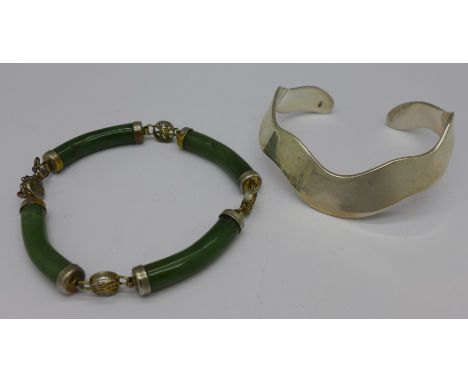 A silver bangle and a Chinese jade bracelet