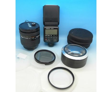 A Nikon 28-200mm lens, Nikon Speed Light SB-28 flash, filters and magnifier