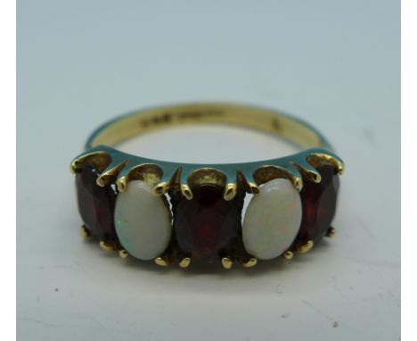 A 9ct gold, garnet and opal ring, 2.8g, S