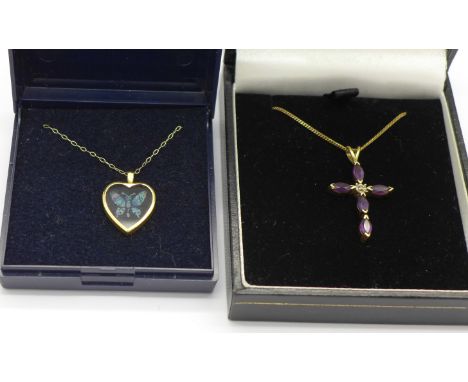 Two 9ct gold pendants and chains;- one amethyst and diamond cross and one opal set butterfly, 4.3g