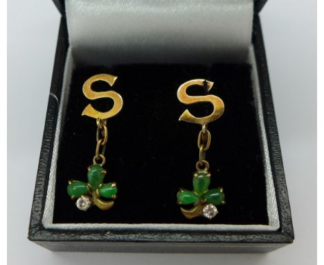 A pair of 14ct gold and jade earrings with screw backs