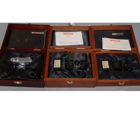 A cased Minox Leica miniature camera, a Minox glass, Contax 1 and a Minox Classic Leica