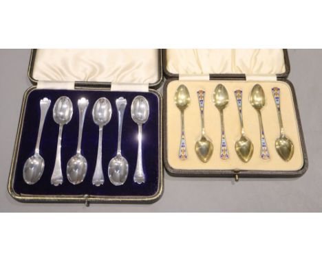 Two cased sets of six silver teaspoons/coffee spoons including silver gilt and enamel by Levi &amp; Salaman, Birmingham, 1927