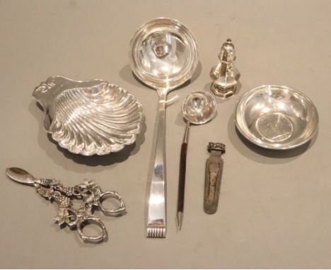 Mixed small silver items, including a 1940's silver soup ladle, 25.5cm, an Edwardian silver butter shell, an 800 standard nut