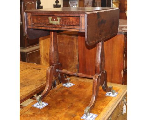 A Regency mahogany drop flap games table, with backgammon interior, W.48cm, D.56cm, H.72cmCONDITION: The top is stained and r