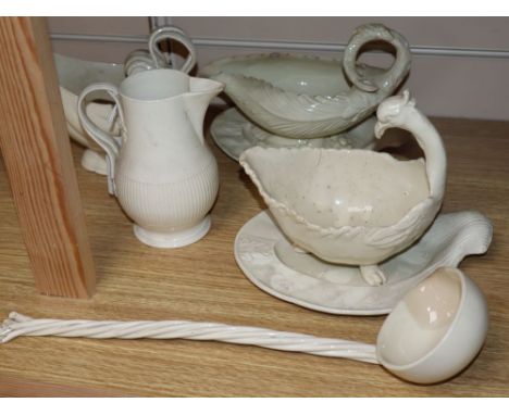 A late 18th century creamware sauce boat and stand, another similar with stand, a sauceboat, jug and ladle