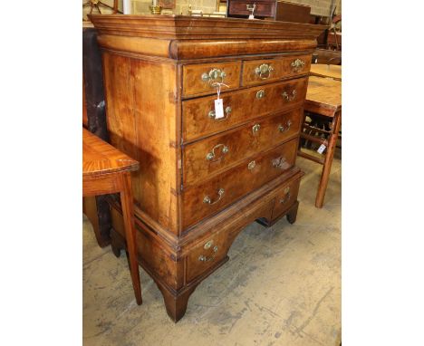 An early 19th century walnut and crossbanded chest on stand, later bracket feet, W.106cm, D.57cm, H.128cmCONDITION: The top h