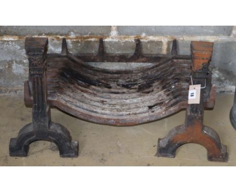 A cast iron fire grate with dogs, W.70cm, D.40cm, H.40cm