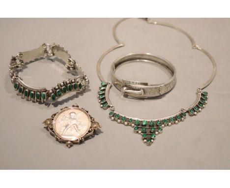 A Mexican 925 and malachite necklace and matching bracelet, a white metal bangle and coin set brooch.