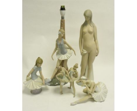 A LLADRO FIGURE OF A NUDE WOMAN, TWO LLADRO FIGURES AND A GROUP OF BALLERINAS AND A NAO FIGURE