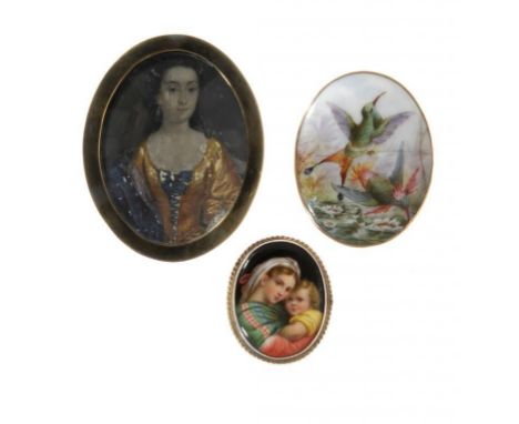 A VICTORIAN SILVER GILT BROOCH set with a Meissen porcelain plaque painted after Raphael with the Madonna and Child, an oval 